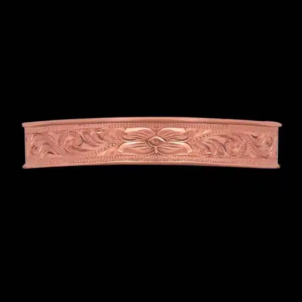 Our Porter Western Cuff bracelet is a blend of rustic charm and timeless Western elegance. Crafted with intricate, hand-engraved scrolls and a gorgeous flower detail on a Copper base.